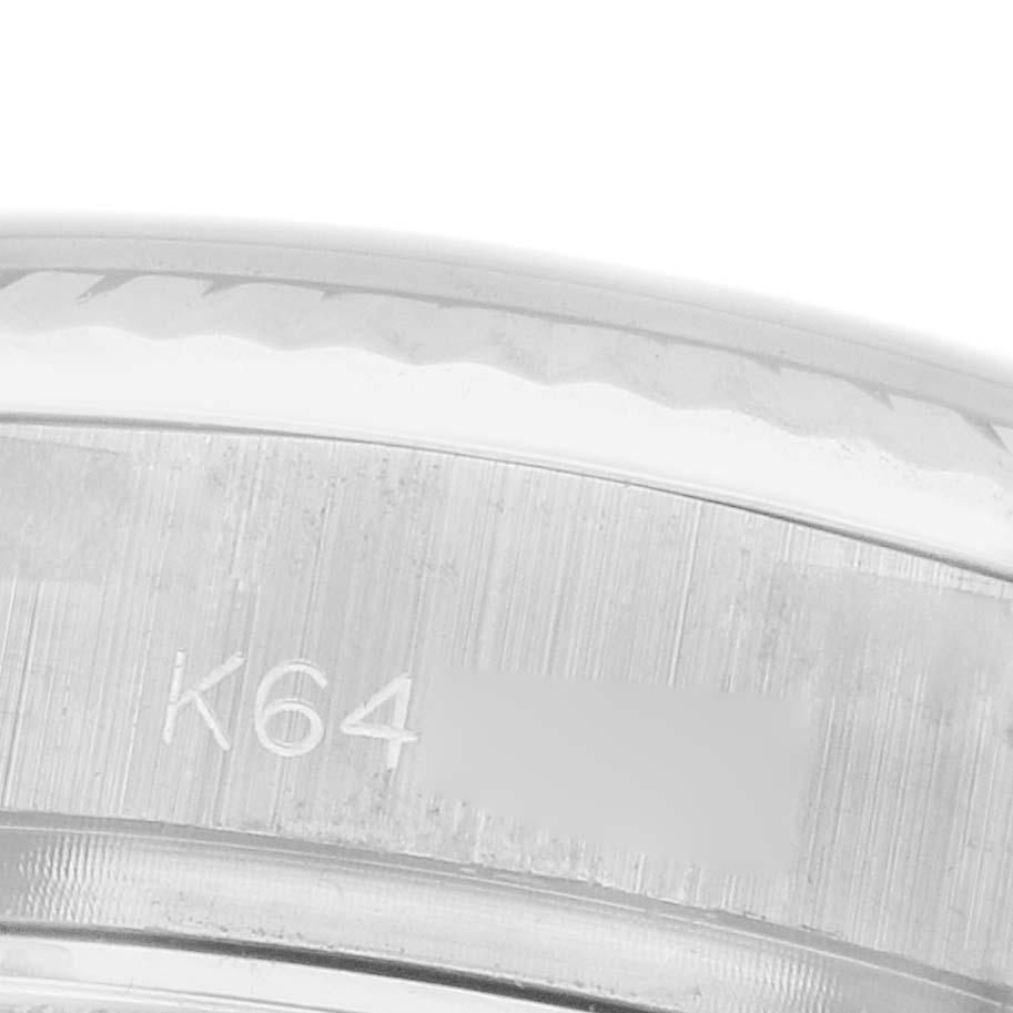 The image shows a close-up of the case back edge of a Rolex President 179179 Women's White Gold Orange Dial model, featuring engraved markings.