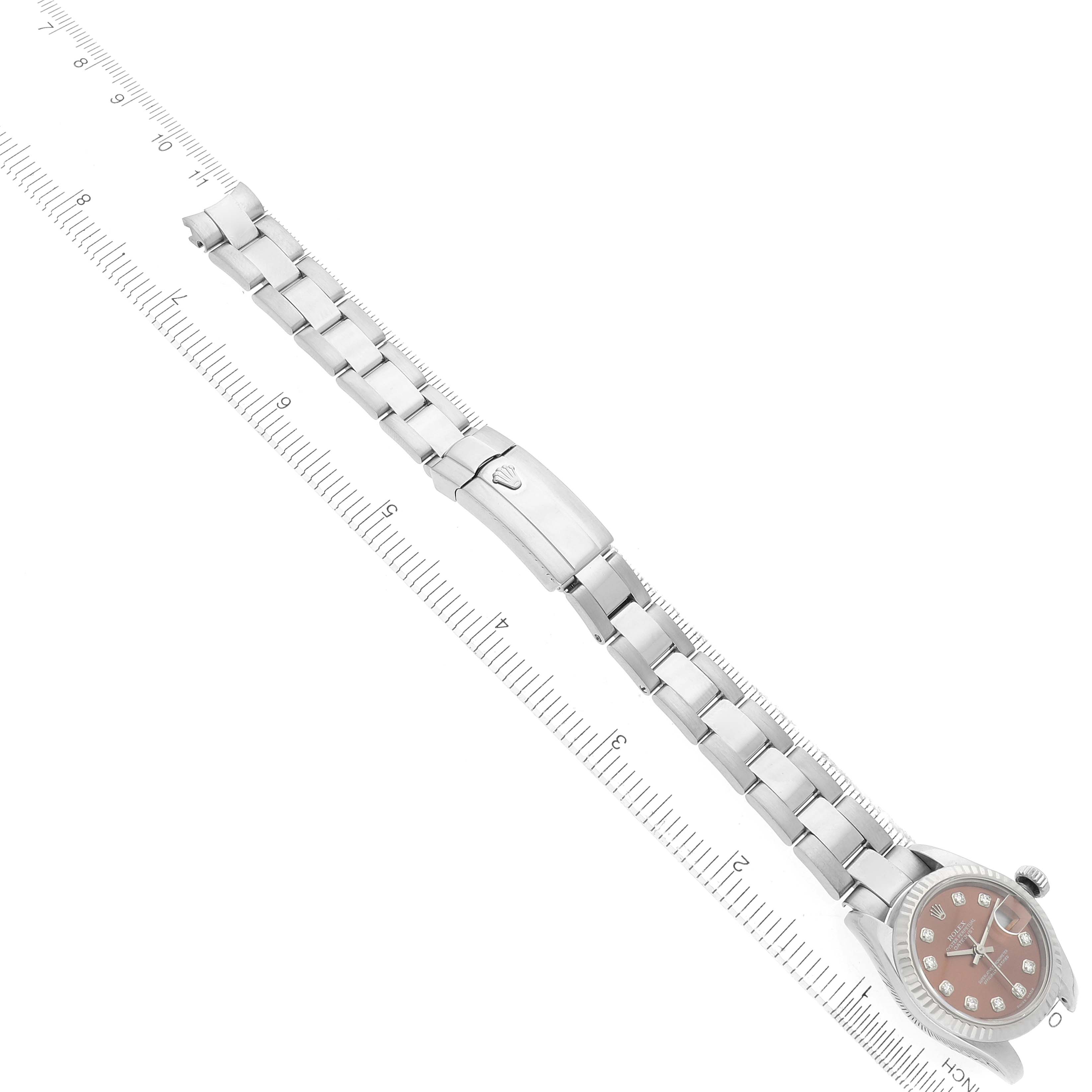The Rolex President 179179 Women's White Gold Orange Dial model is shown from a top view, highlighting its bracelet and clasp design.