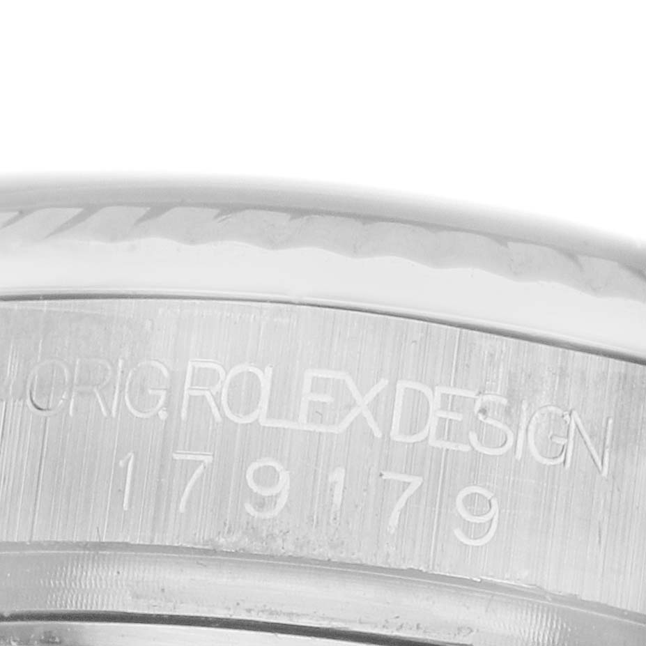 The image shows a close-up of the side of a Rolex President 179179 Women's White Gold Orange Dial watch, highlighting the engraved "ORIG. ROLEX DESIGN" and model number.