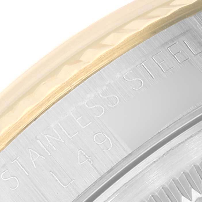 This image shows a close-up of the side engraving on a Rolex Datejust 16233 Men's Steel and Gold (two tone) Champagne Dial 16233 Men's Steel and Gold (two tone) Champagne Dial's bezel, displaying "Stainless Steel" text.