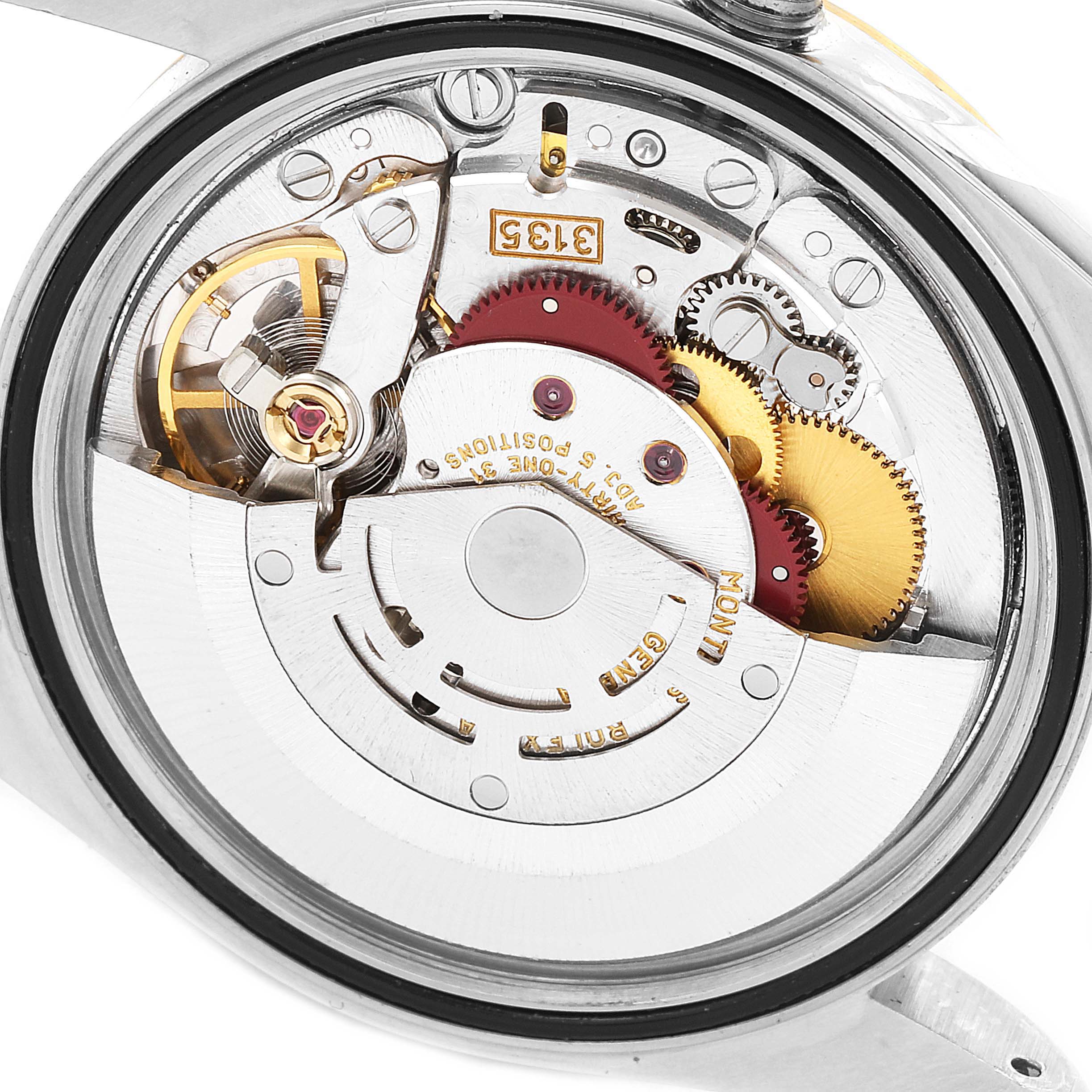 The image shows a close-up view of the movement mechanism of a Rolex Datejust 16233 Men
s Steel and Gold (two tone) Grey Dial 16233 Men
s Steel and Gold (two tone) Grey Dial model.