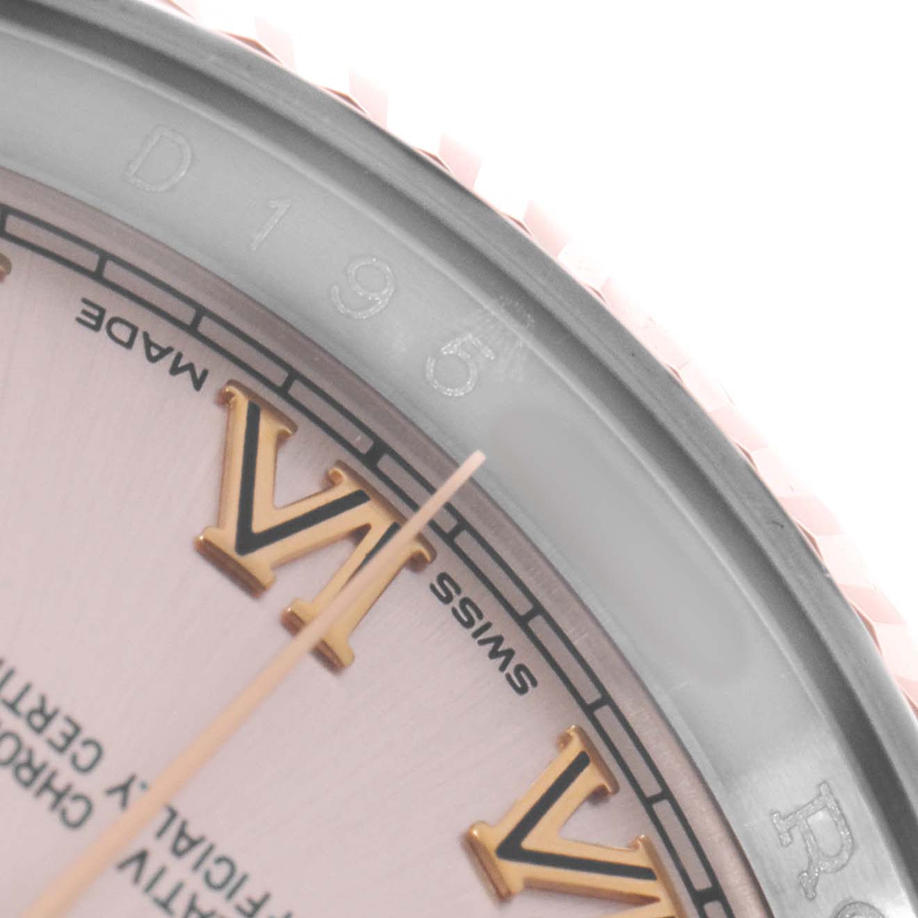 The image shows a close-up view of the dial and bezel of a Rolex Datejust 116231 Men
s Steel and Gold (two tone) Pink Dial watch, focusing on the Roman numerals and text.