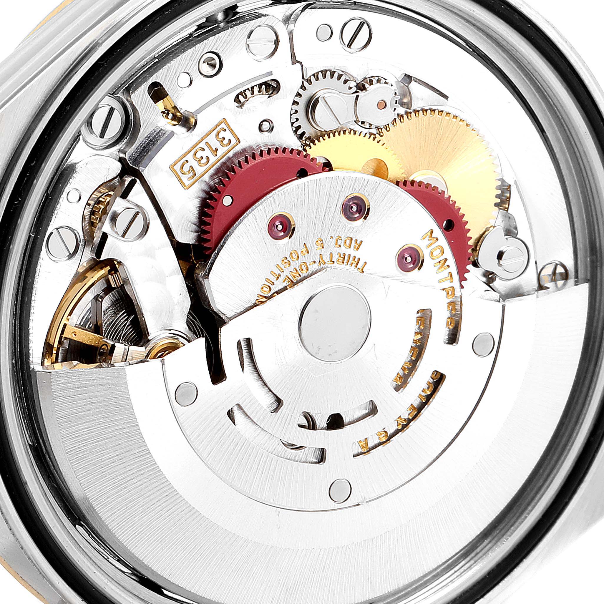 This is a close-up view of the internal mechanical movement of a Rolex Datejust 16233 Men's Steel and Gold (two tone) Black Dial 16233 Men's Steel and Gold (two tone) Black Dial watch, showcasing gears and components.