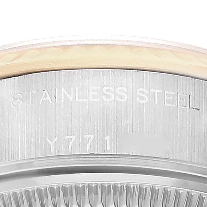 This image shows a close-up of the case back and some engraving on the stainless steel of the Rolex Datejust 79173 Women's Steel and Gold (two tone) Champagne Dial 79173 Women's Steel and Gold (two tone) Champagne Dial watch.