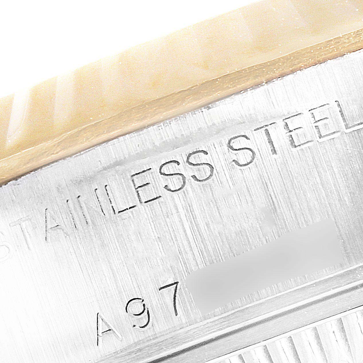 The image shows a close-up of the case side of the Rolex Datejust 79173 Women's Stainless Steel Silver Dial 79173 Women's Stainless Steel Silver Dial, highlighting the stainless steel inscription.