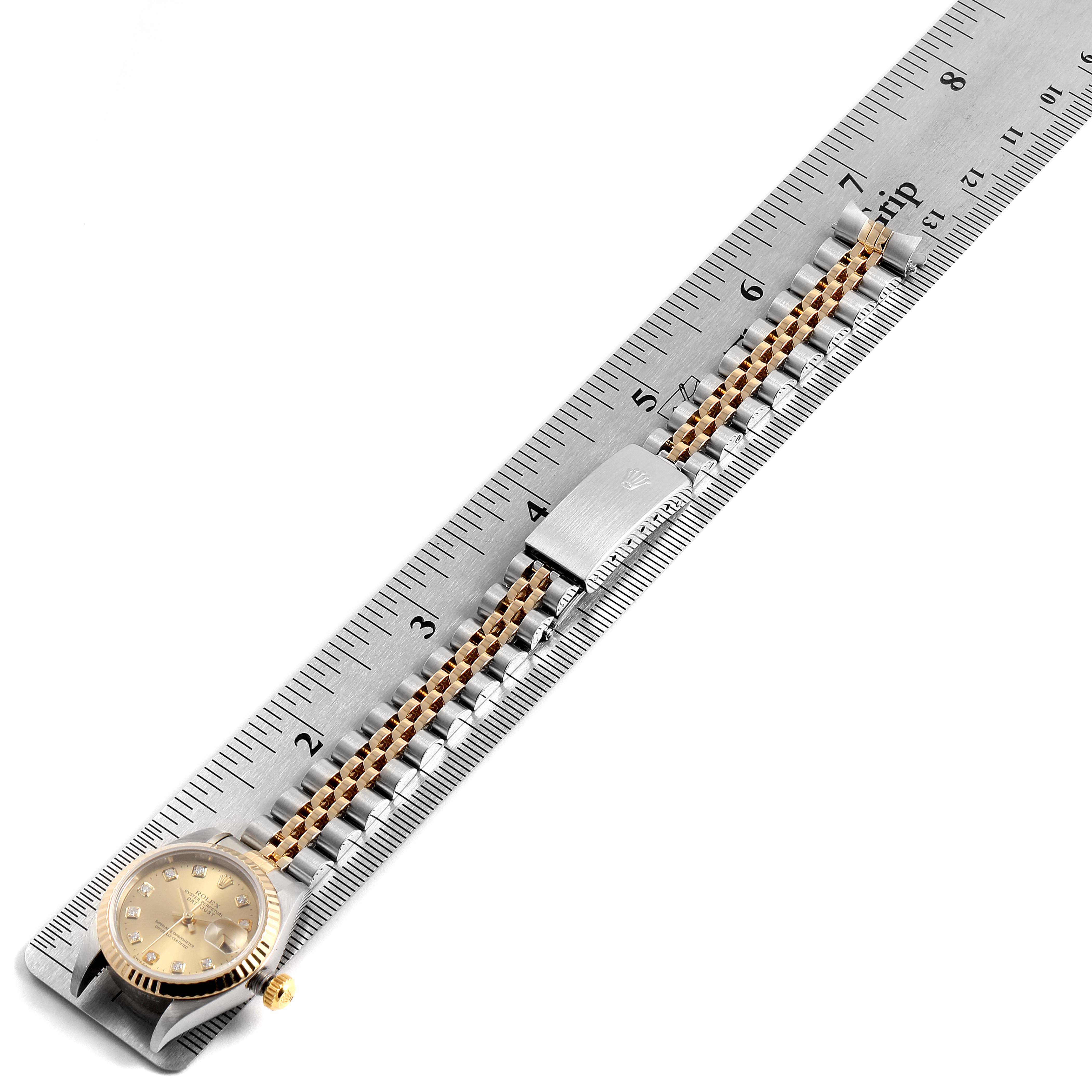 The image shows a Rolex Datejust 79173 Women's Stainless Steel Champagne Dial 79173 Women's Stainless Steel Champagne Dial watch laid flat with a ruler, displaying its face and bracelet.
