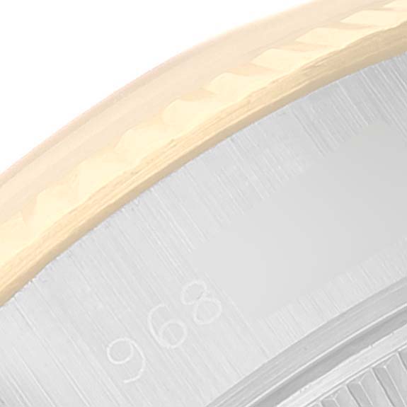 This image shows a close-up of the bezel and part of the dial of a Rolex Datejust 69173 Women's Steel and Gold (two tone) Champagne Dial 69173 Women's Steel and Gold (two tone) Champagne Dial watch.