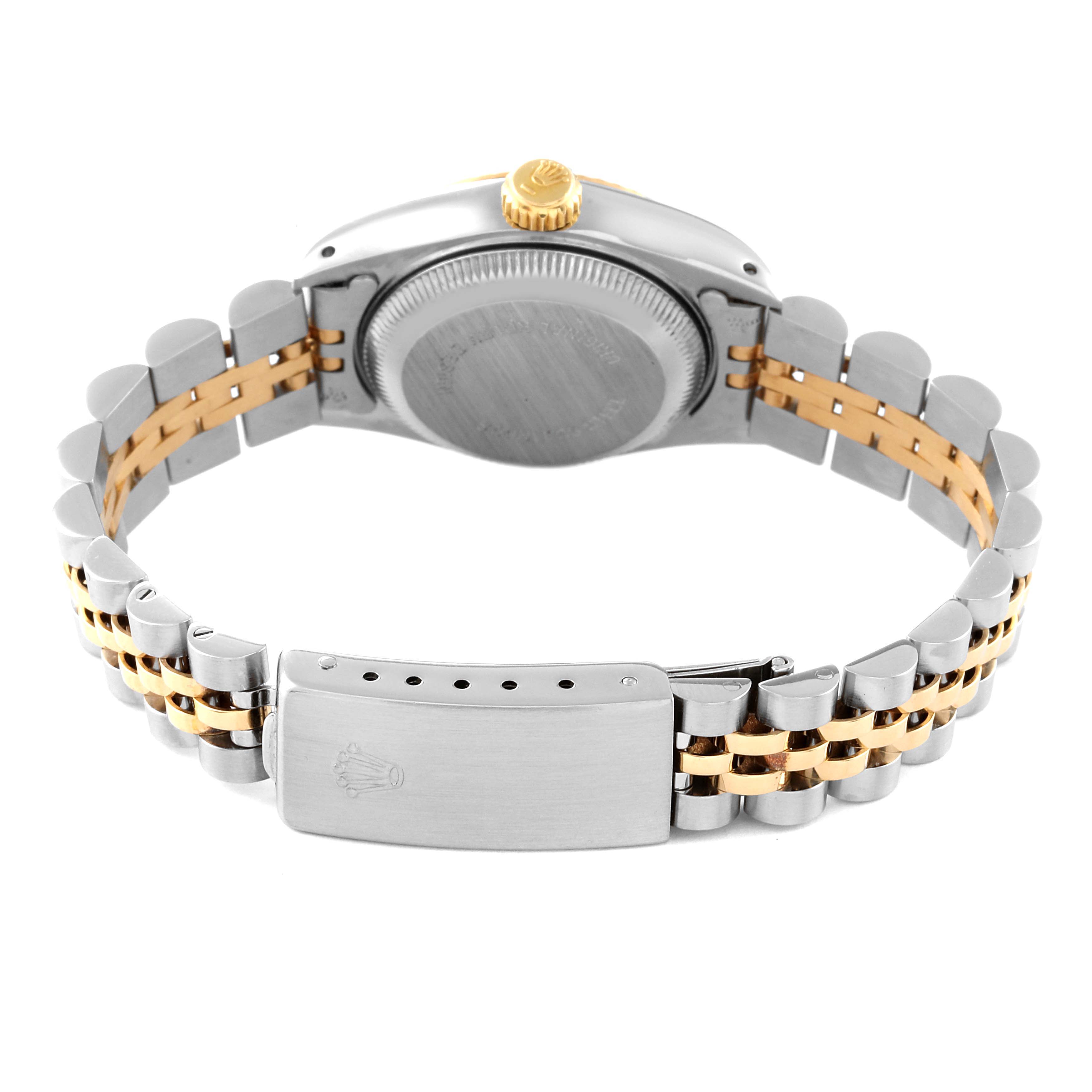 This image shows the back case, crown, and clasp of the Rolex Datejust 69173 Women's Steel and Gold (two tone) Champagne Dial 69173 Women's Steel and Gold (two tone) Champagne Dial model with a two-tone bracelet.