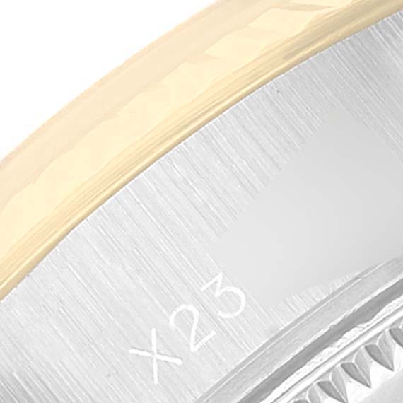 The image shows a close-up of the Rolex Datejust 69173 Women's Steel and Gold (two tone) Champagne Dial 69173 Women's Steel and Gold (two tone) Champagne Dial watch's case, focusing on the side and part of the bezel.