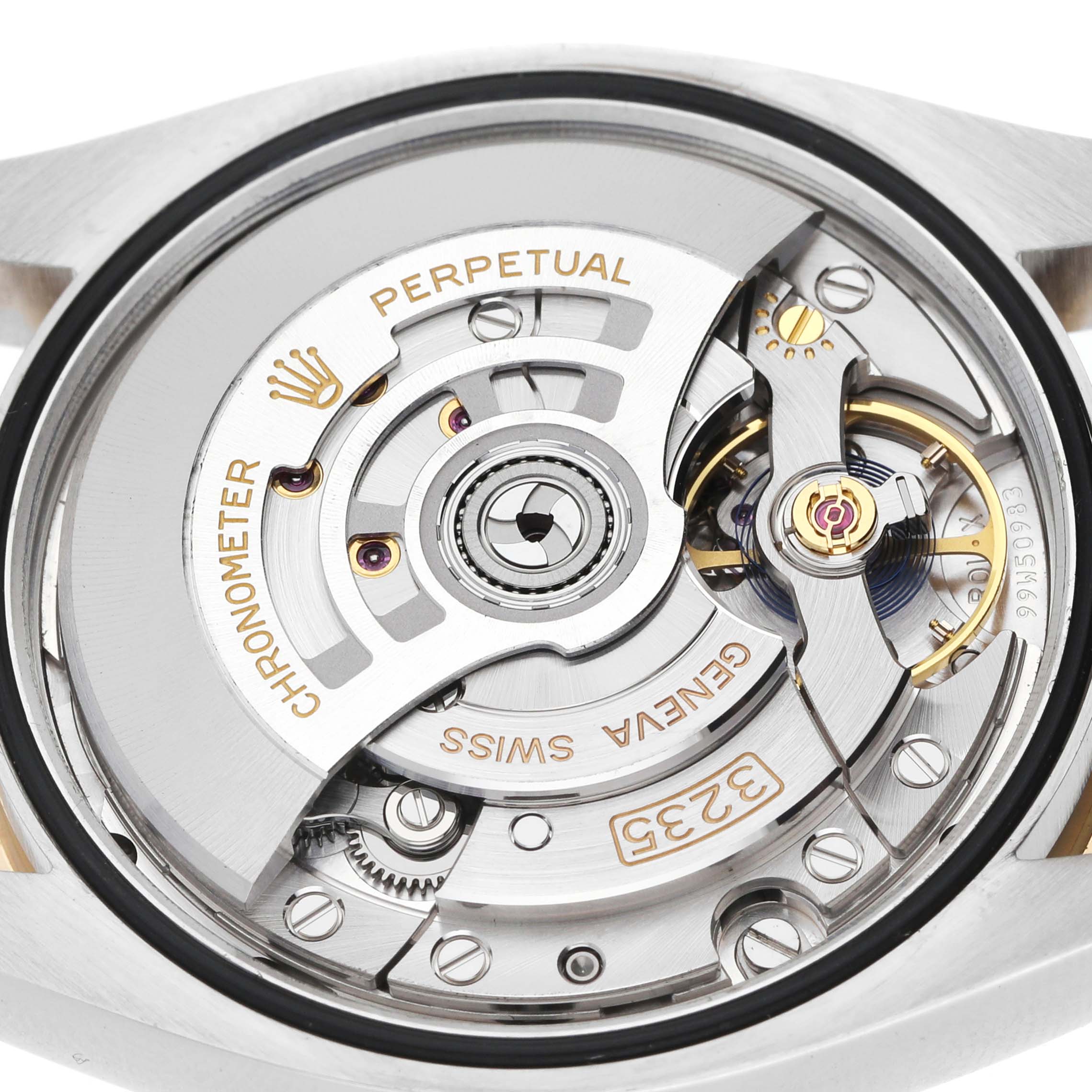 The image shows the back view of a Rolex Datejust 126283 Men's Steel and Gold (two tone) Mother of Pearl Dial, highlighting its intricate movement and rotor.