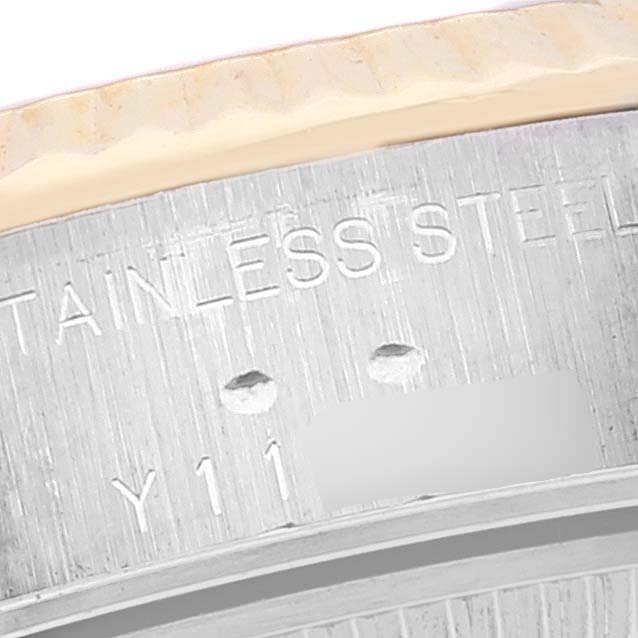 This close-up shows the engraving on the side of the stainless steel case of a Rolex Datejust 79173 Women's Steel and Gold (two tone) Grey Dial 79173 Women's Steel and Gold (two tone) Grey Dial watch.