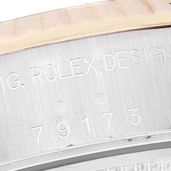 The image shows an angled close-up of the inner bezel with the engraved model number and “ROLEX DESIGN” of the Rolex Datejust 79173 Women's Steel and Gold (two tone) Grey Dial 79173 Women's Steel and Gold (two tone) Grey Dial.