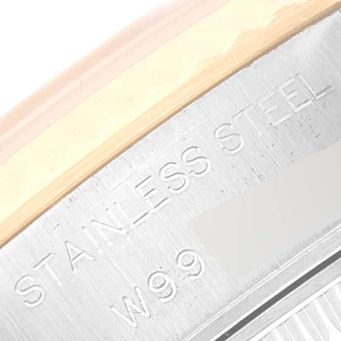 This close-up image shows the engraved "STAINLESS STEEL" marking on the side of a Rolex Datejust 69173 Women's Steel and Gold (two tone) Champagne Dial 69173 Women's Steel and Gold (two tone) Champagne Dial watch's case.