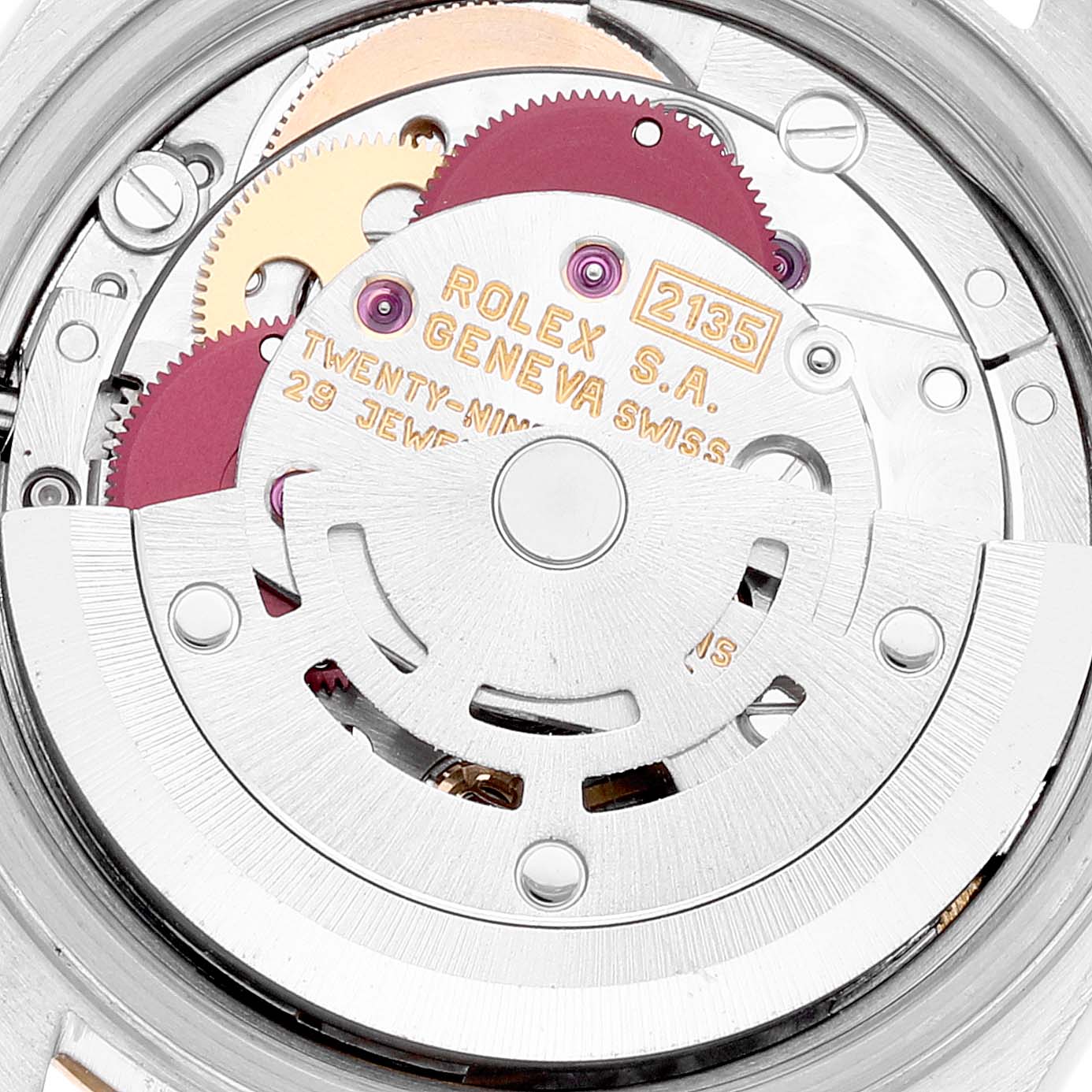The image shows a close-up angle of the movement mechanism of a Rolex Datejust 69173 Women's Steel and Gold (two tone) Champagne Dial 69173 Women's Steel and Gold (two tone) Champagne Dial watch, highlighting gears and inscriptions.