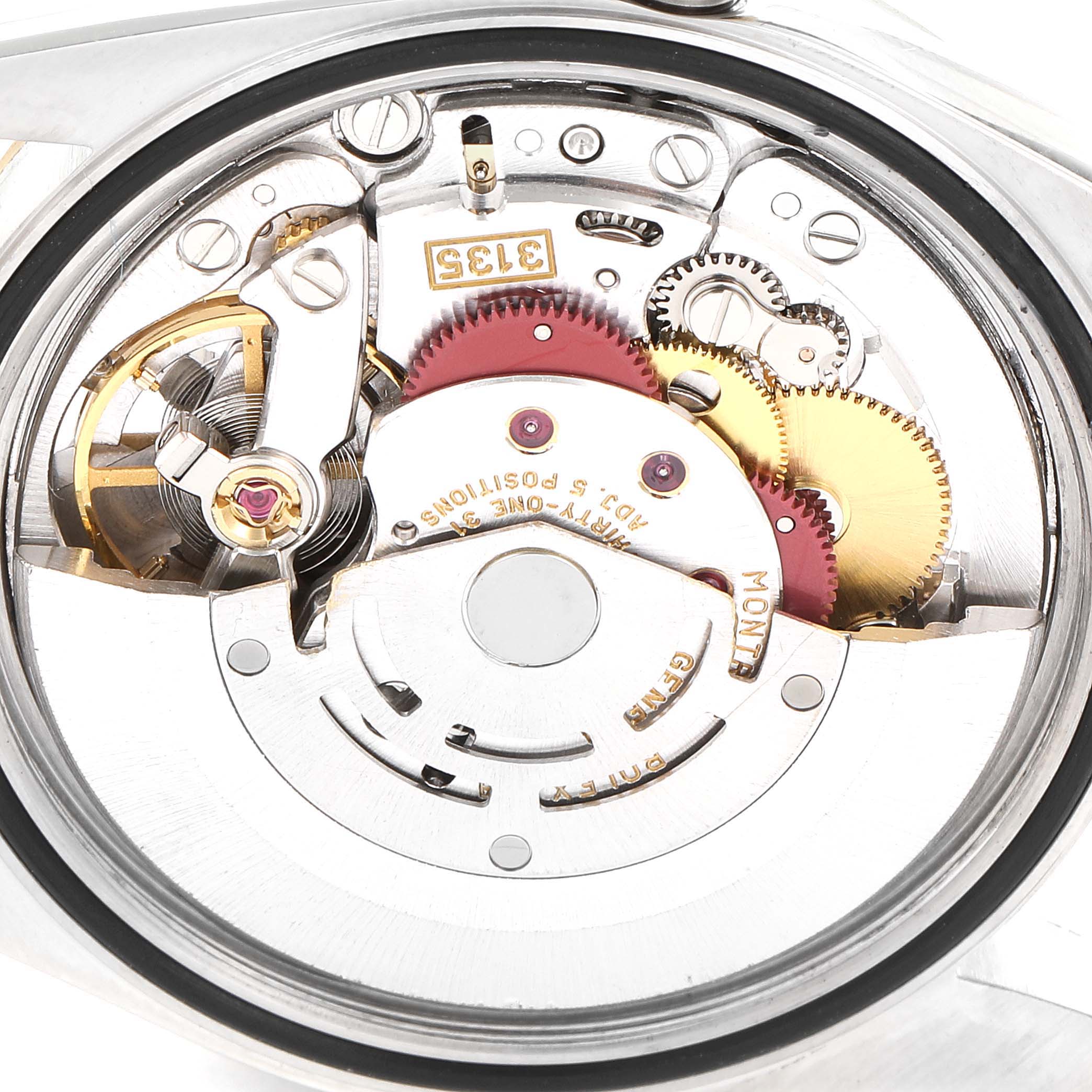 The image shows the intricate mechanism and inner movement of a Rolex Datejust 16233 Men's Steel and Gold (two tone) White Dial 16233 Men's Steel and Gold (two tone) White Dial watch from a close-up angle.