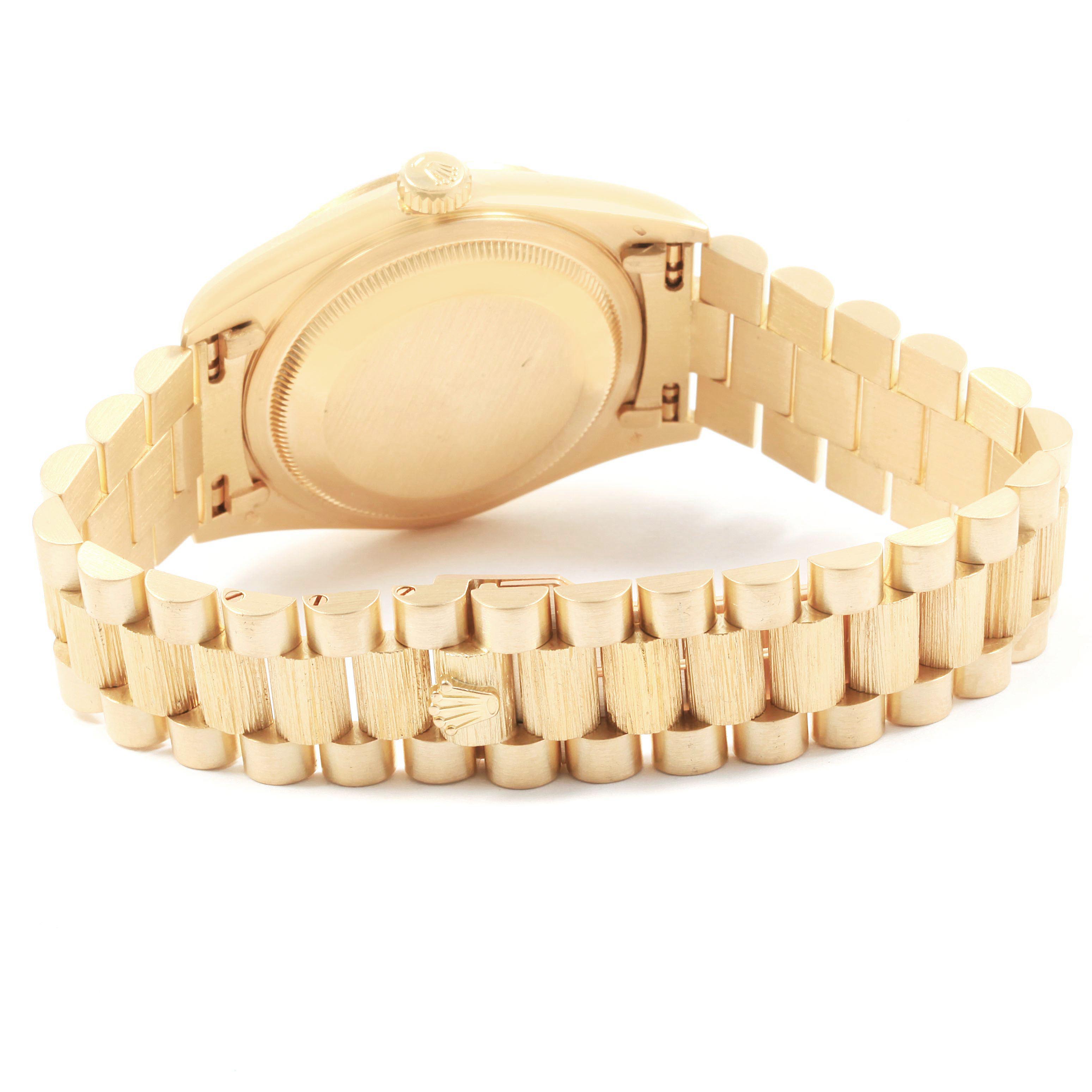 The image shows the backside and the bracelet of a Rolex President 18248 Men's Yellow Gold Silver Dial 18248 Men's Yellow Gold Silver Dial model watch.