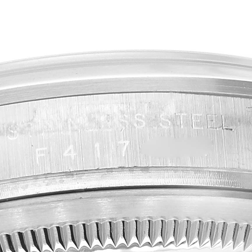 This close-up image shows the side view of the bezel and caseback with serial engraving on a Rolex Explorer 114270 Men's Stainless Steel Black Dial 114270 Men's Stainless Steel Black Dial.