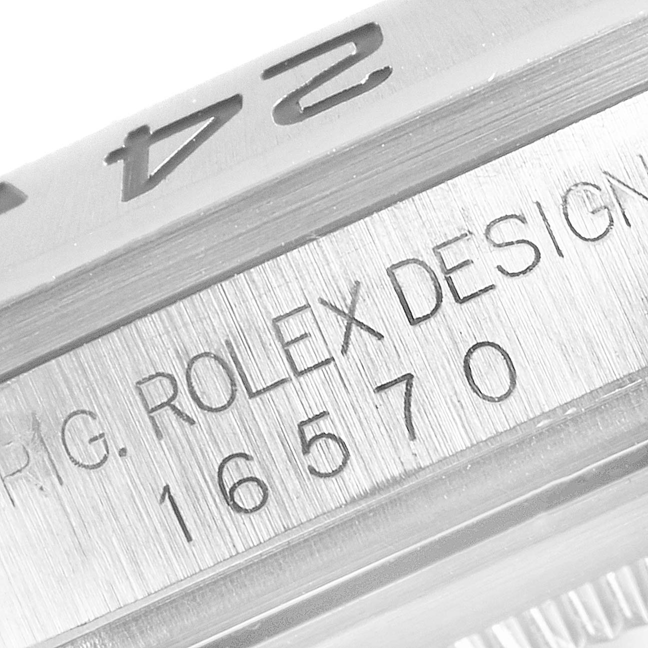 The image shows a close-up of the serial number engraving on the side of a Rolex Explorer 16570 Men
s Stainless Steel Black Dial 16570 Men
s Stainless Steel Black Dial model.