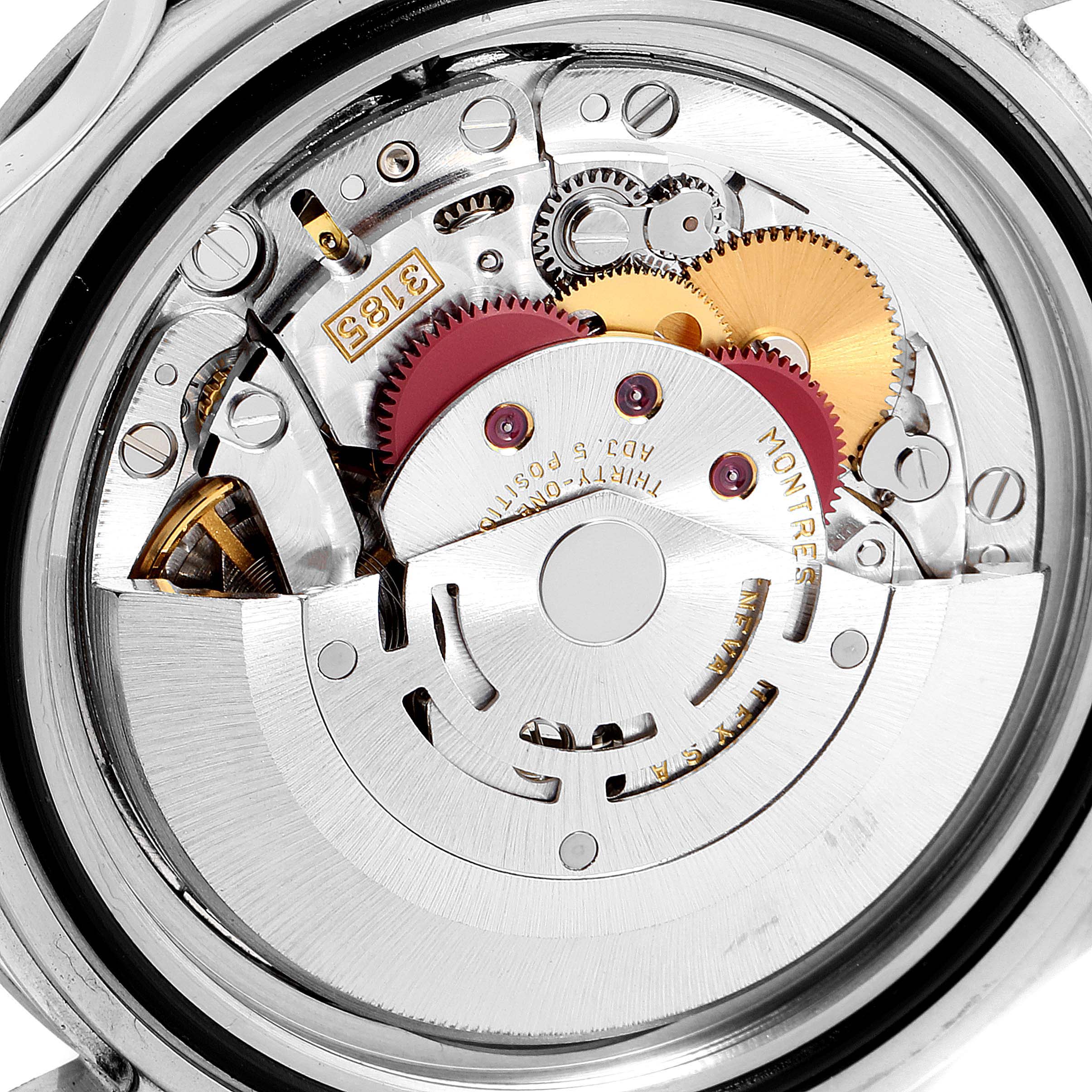 The image shows the internal mechanism of the Rolex Explorer 16570 Men
s Stainless Steel Black Dial 16570 Men
s Stainless Steel Black Dial watch, highlighting gears and mechanical components from the back.