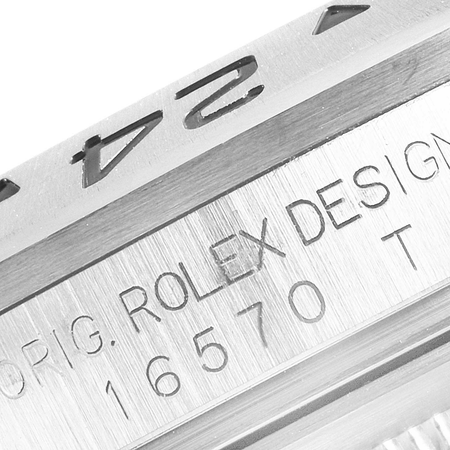 The image shows a close-up of the bezel and casing with engraved text on the Rolex Explorer 16570 Men's Stainless Steel Black Dial 16570 Men's Stainless Steel Black Dial model 16570.