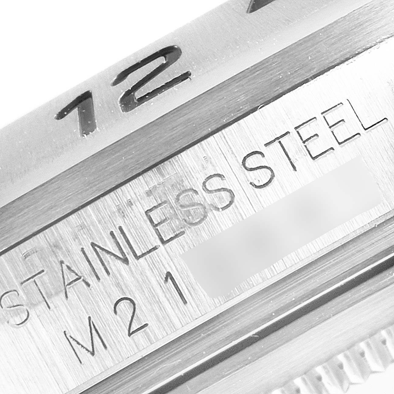 Close-up of the Rolex Explorer 16570 Men's Stainless Steel Black Dial 16570 Men's Stainless Steel Black Dial watch, showing the stainless steel case and engraved serial markings.