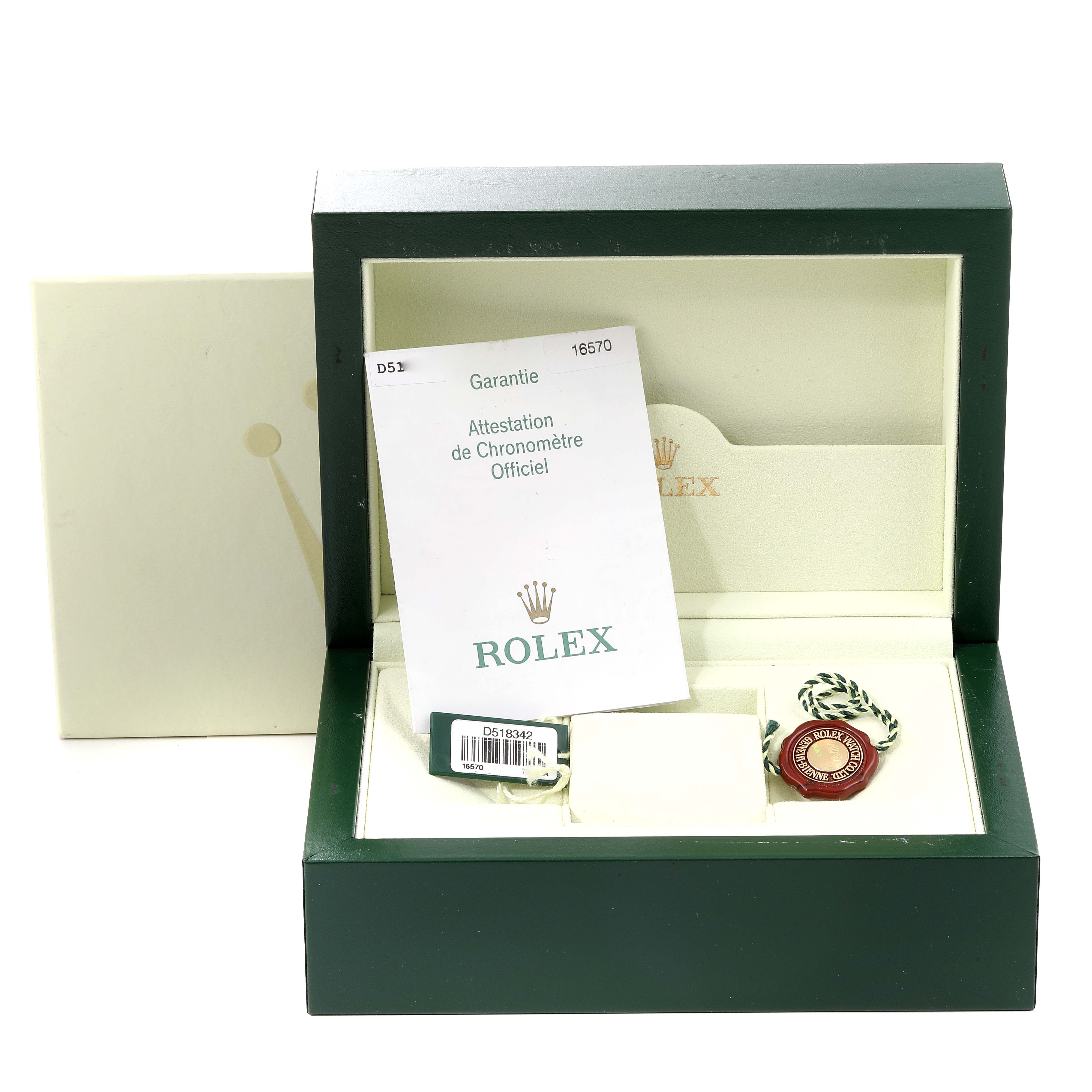 The image shows an open box for the Rolex Explorer 16570 Men
s Stainless Steel Black Dial 16570 Men
s Stainless Steel Black Dial model, displaying documents, a tag, and accessories.