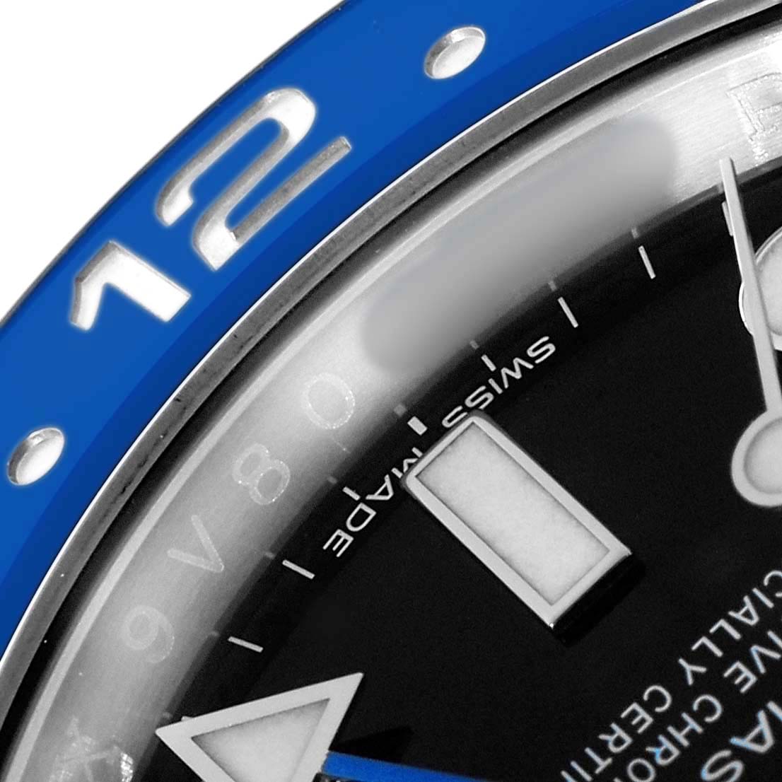 The image shows a close-up of the bezel and part of the dial of a Rolex GMT-Master 116710 Men's Stainless Steel Black Dial, highlighting the "12" numeral and markers.