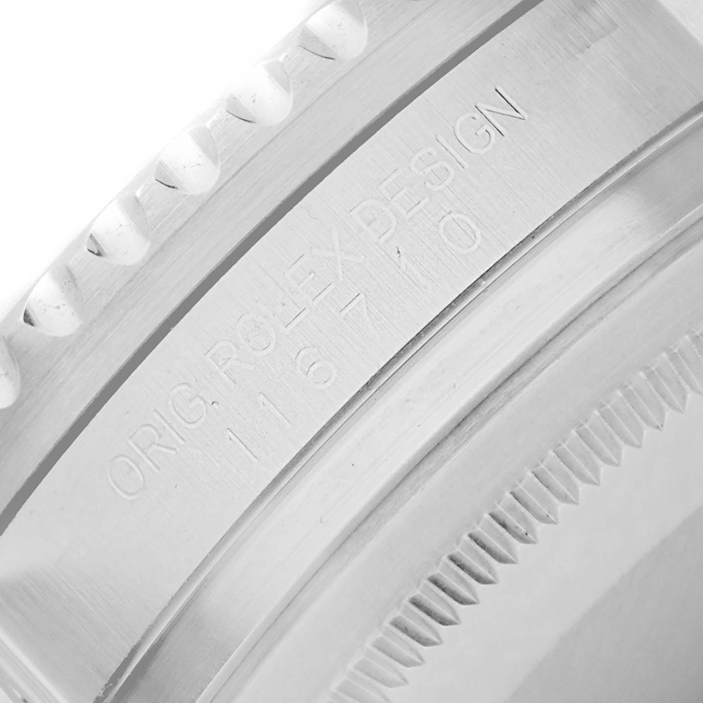 The image shows a close-up of the bezel and engraved inner ring of a Rolex GMT-Master 116710 Men's Stainless Steel Black Dial watch.