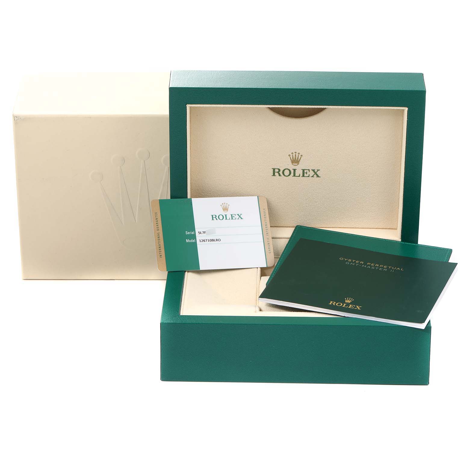 This image shows the packaging, card, and booklet for a Rolex GMT-Master 126710 Men
s Stainless Steel Black Dial 126710 Men
s Stainless Steel Black Dial watch.
