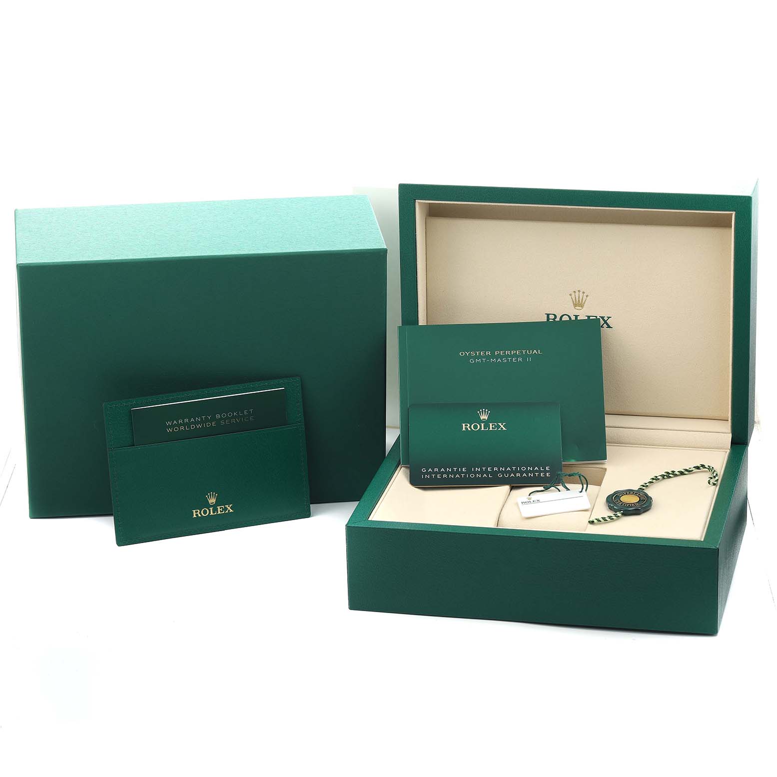 The image shows a Rolex GMT-Master 126729VTNR Men's White Gold Green Dial box, warranty booklets, and tag from a top-front angle.