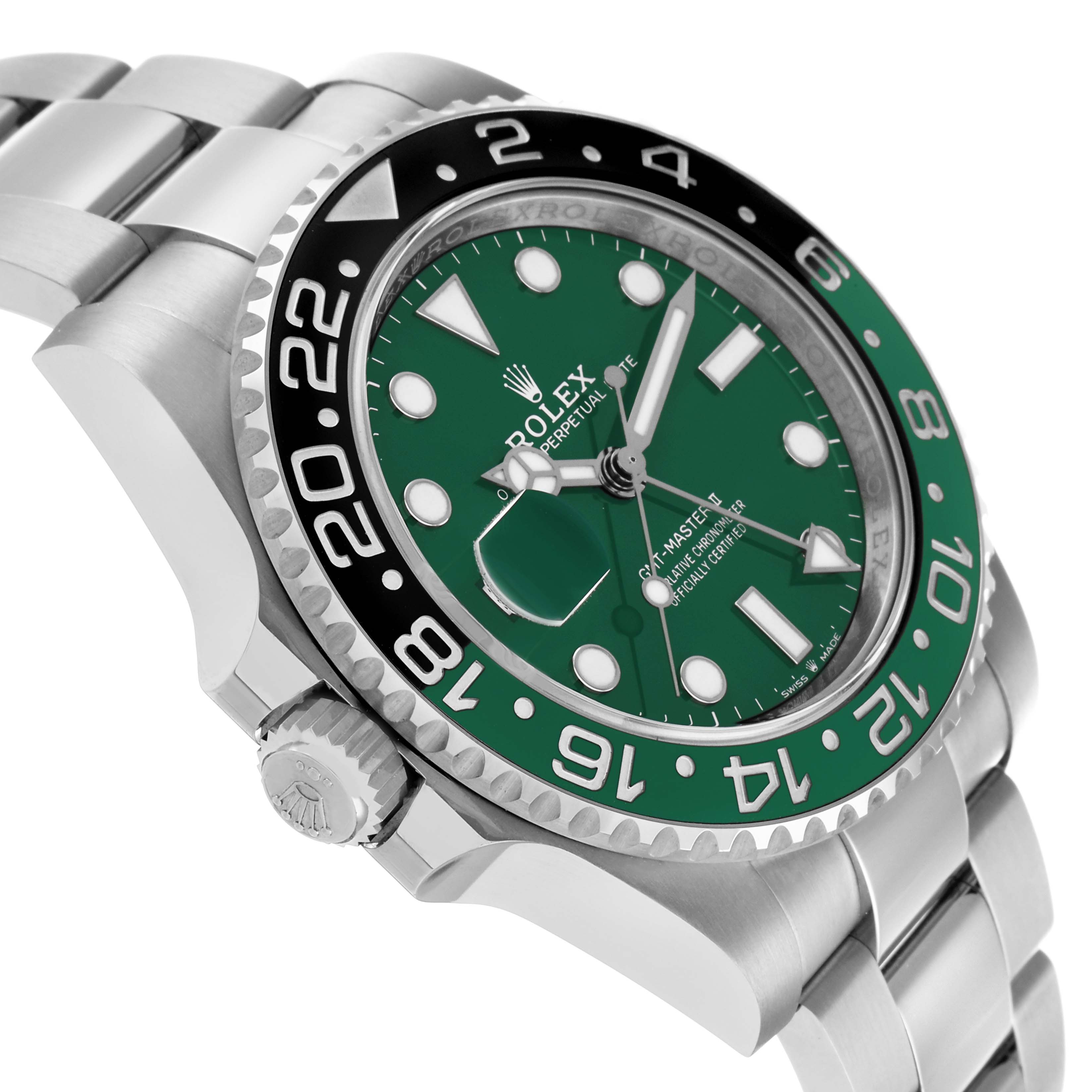 The Rolex GMT-Master 126729VTNR Men's White Gold Green Dial watch is shown at an angled view, displaying the bezel, crown, bracelet, and a green dial.