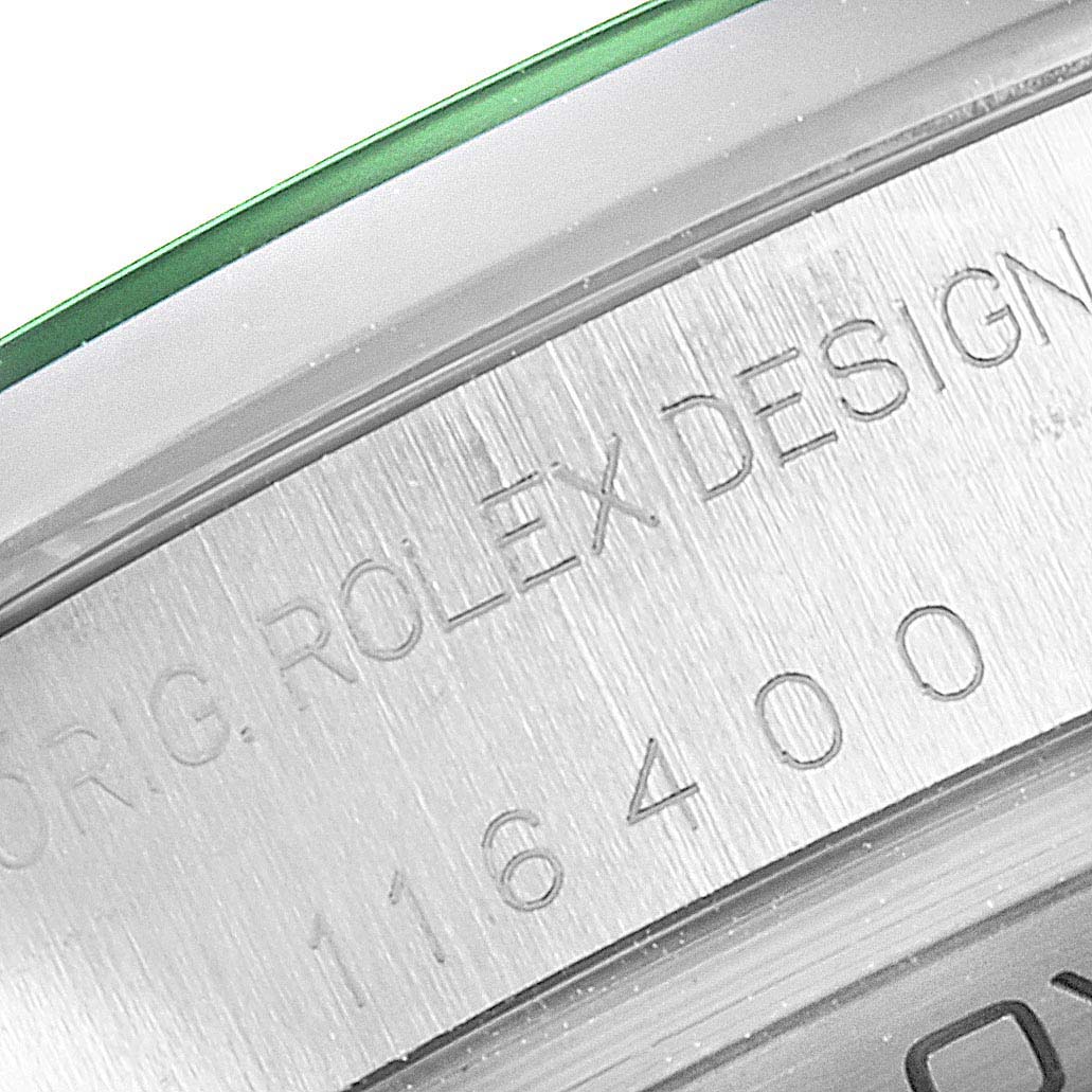 This image shows a close-up of the engraved case side of a Rolex Milgauss 116400V Men's Stainless Steel Black Dial 116400V Men's Stainless Steel Black Dial model, highlighting the "ROLEX DESIGN" inscription.