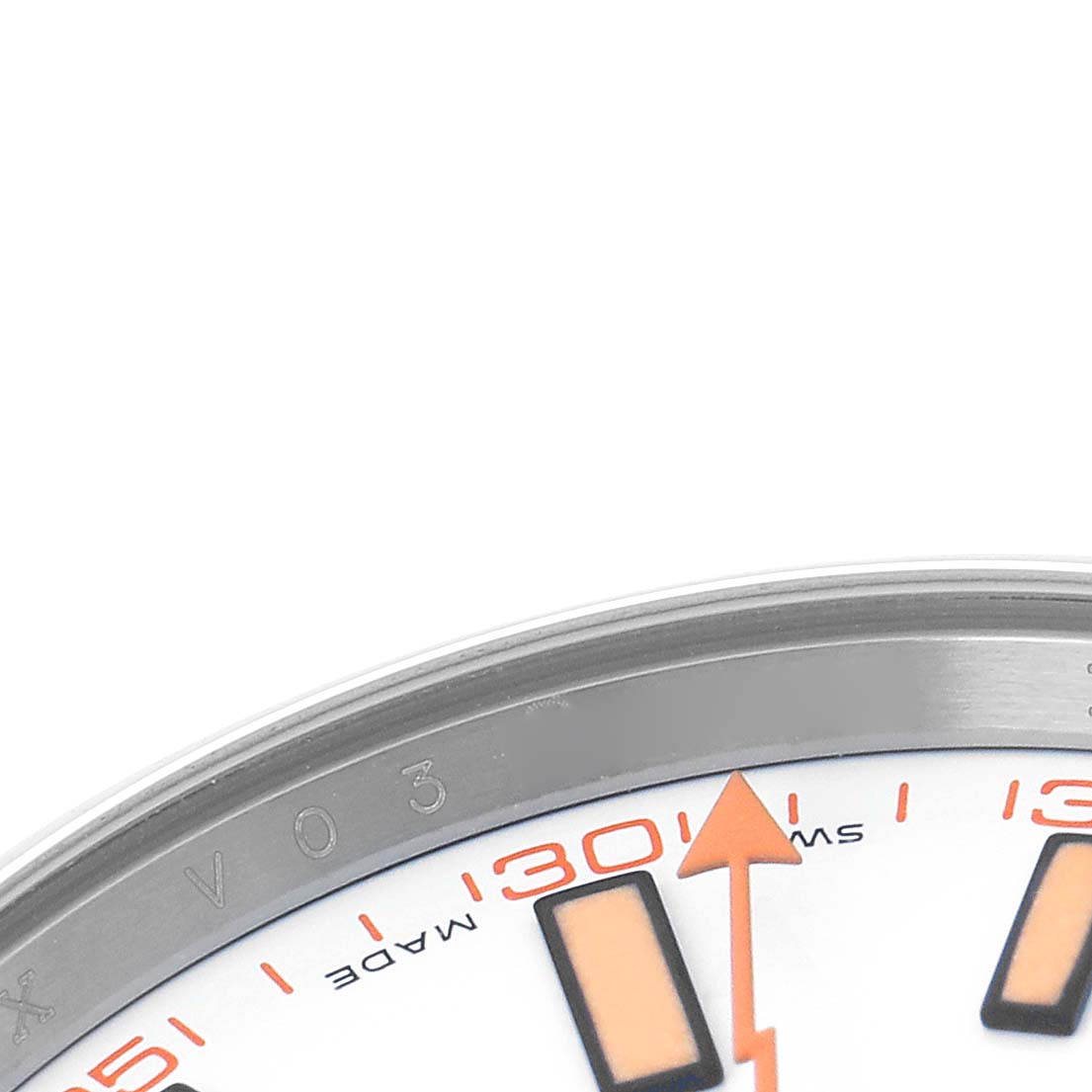 The image shows a close-up of the Rolex Milgauss 116400 Men's Stainless Steel White Dial watch face, highlighting the edge of the bezel and part of the dial with markers.