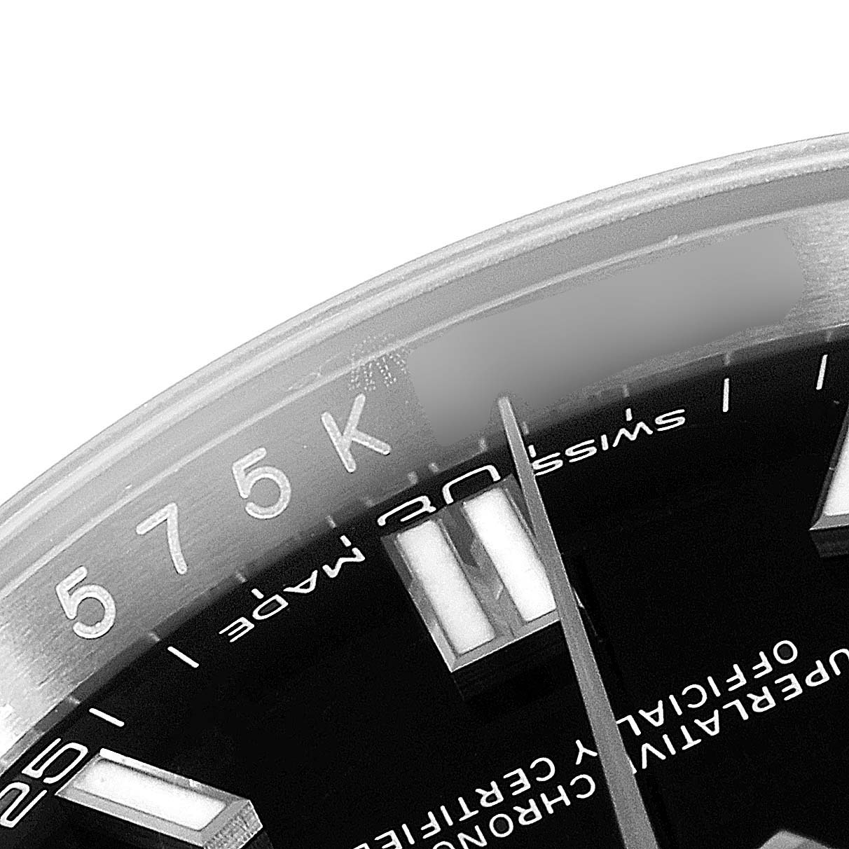 This image shows a close-up of the dial and bezel of a Rolex Oyster Perpetual 116000 Men's Stainless Steel Black Dial 116000 Men's Stainless Steel Black Dial watch, highlighting the markers and inscriptions.