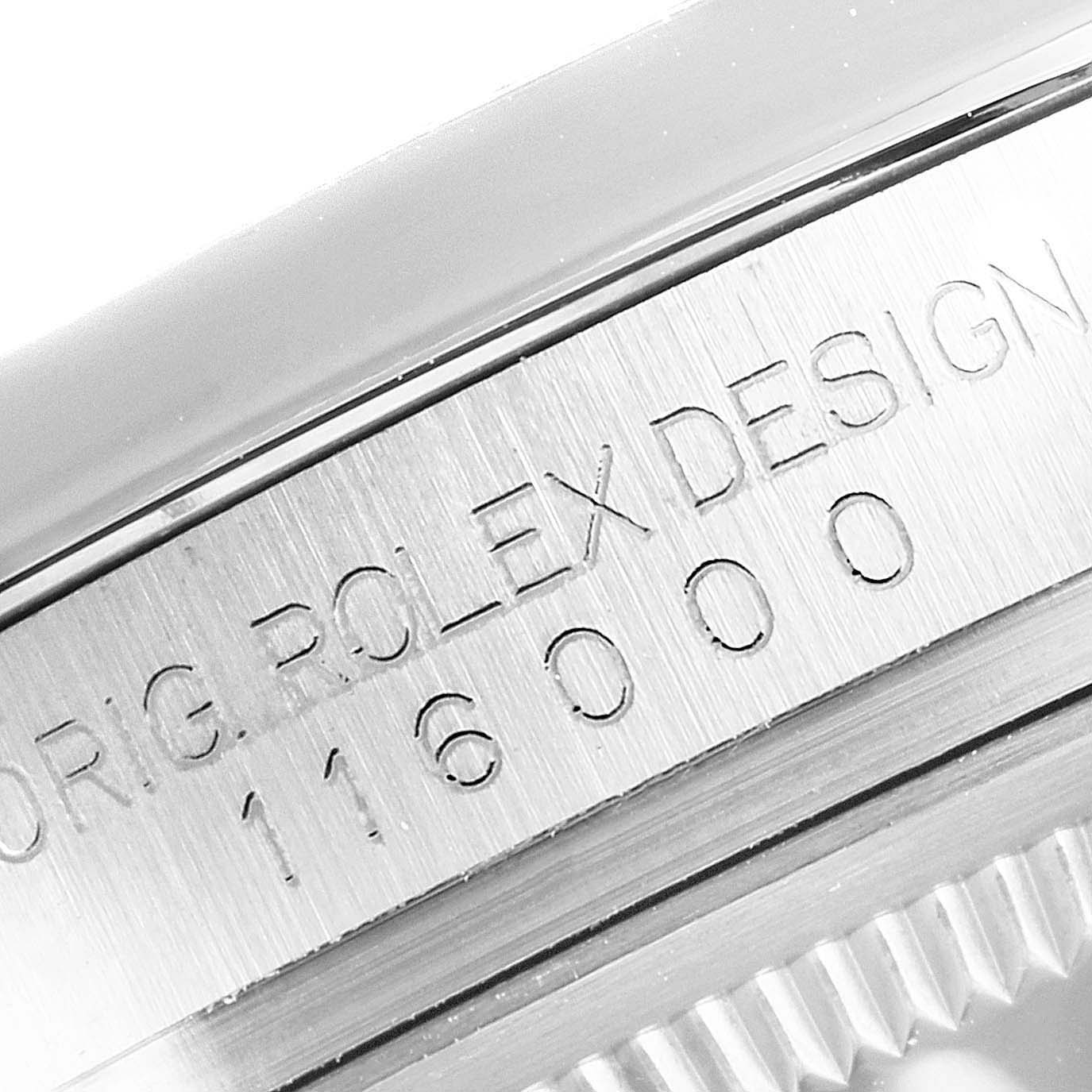 The image shows the inner bezel of a Rolex Oyster Perpetual 116000 Men's Stainless Steel Black Dial 116000 Men's Stainless Steel Black Dial watch, featuring the model number and "ORIG. ROLEX DESIGN" engraving.
