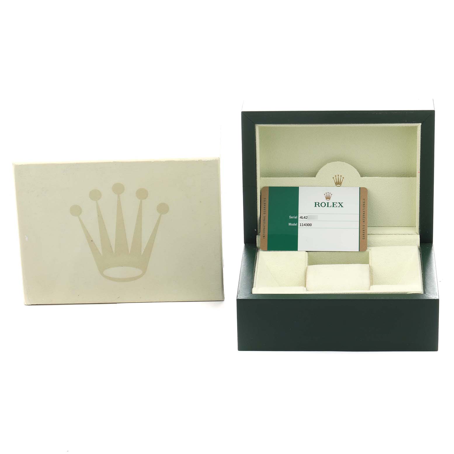 The image shows a Rolex Oyster Perpetual 114300 Men's Stainless Steel Silver Dial watch box, an outer box, and a warranty card inside.