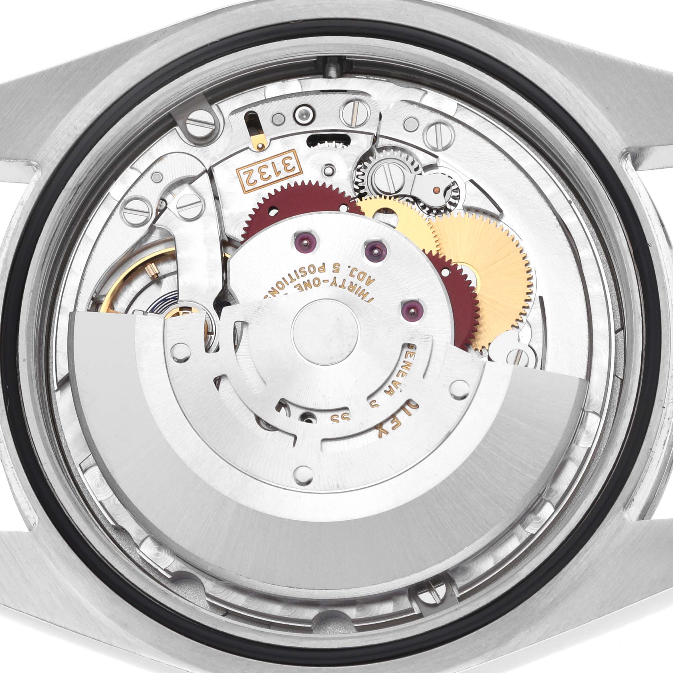 The image shows the inner workings of a Rolex Oyster Perpetual 114300 Men
s Stainless Steel Blue Dial watch, focusing on its movement mechanisms.