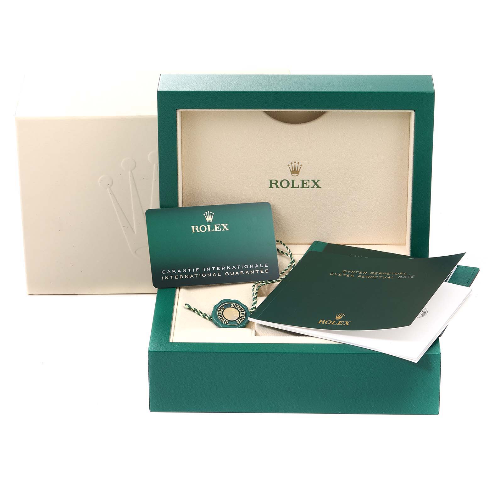 The image shows an open Rolex Oyster Perpetual 124300 Men's Stainless Steel Black Dial 124300 Men's Stainless Steel Black Dial box with its international guarantee card and manuals.