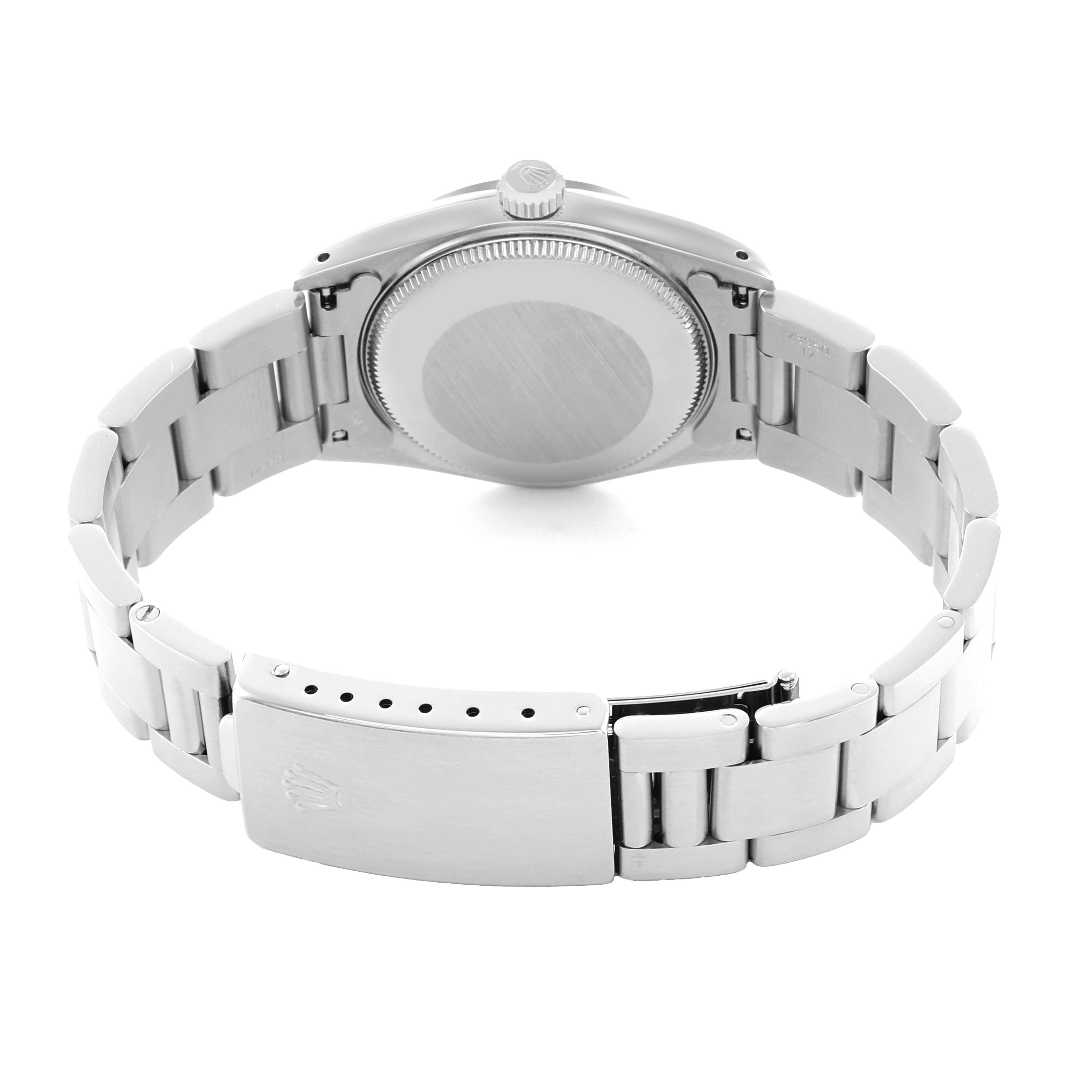 The Rolex Mid-Size 67480 Women
s Stainless Steel Black Dial watch is shown from the back, highlighting the clasp, bracelet links, case back, and crown.