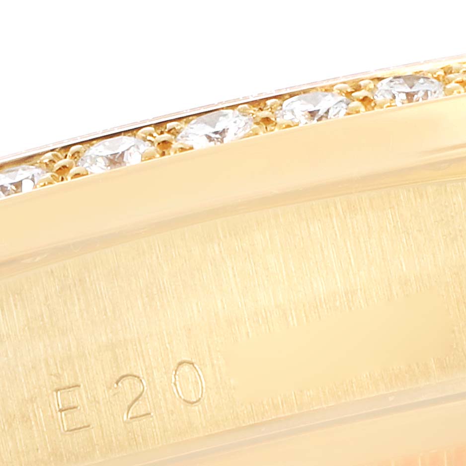 This image shows a close-up of the bezel of a Rolex President 18348 Men's Stainless Steel Champagne Dial 18348 Men's Stainless Steel Champagne Dial model watch, featuring diamonds and engraved markings.