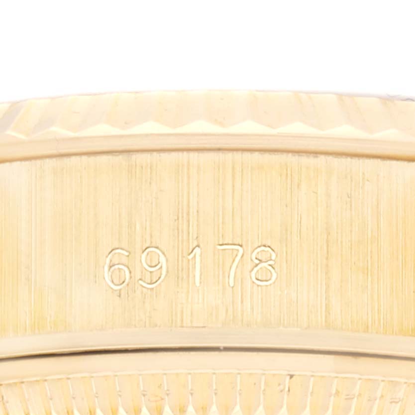 This close-up shows the reference number 69178 on the side of a Rolex President 69178 Women
s Yellow Gold Champagne Dial 69178 Women
s Yellow Gold Champagne Dial model watch.