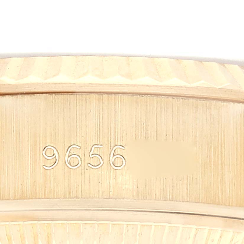 This image shows a close-up of the case edge and serial number engraving on a Rolex President 69178 Women
s Yellow Gold Champagne Dial 69178 Women
s Yellow Gold Champagne Dial model watch.