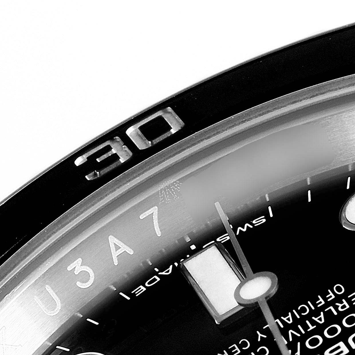 This close-up angle shows the bezel and part of the dial of the Rolex Submariner 114060 Men's Stainless Steel Black Dial 114060 Men's Stainless Steel Black Dial watch.