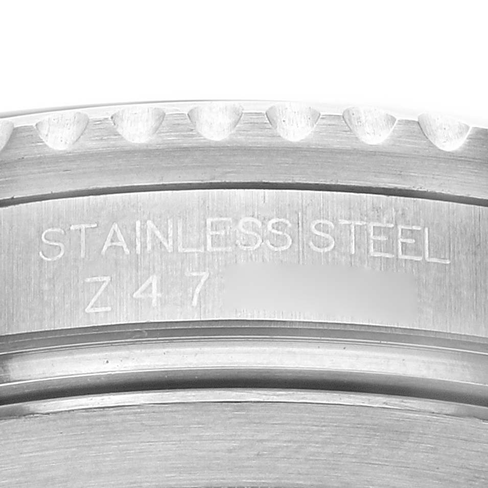 This image shows a close-up view of the bezel edge and engraved stainless steel inscription of a Rolex Submariner 16610 Men
s Stainless Steel Black Dial 16610 Men
s Stainless Steel Black Dial watch.