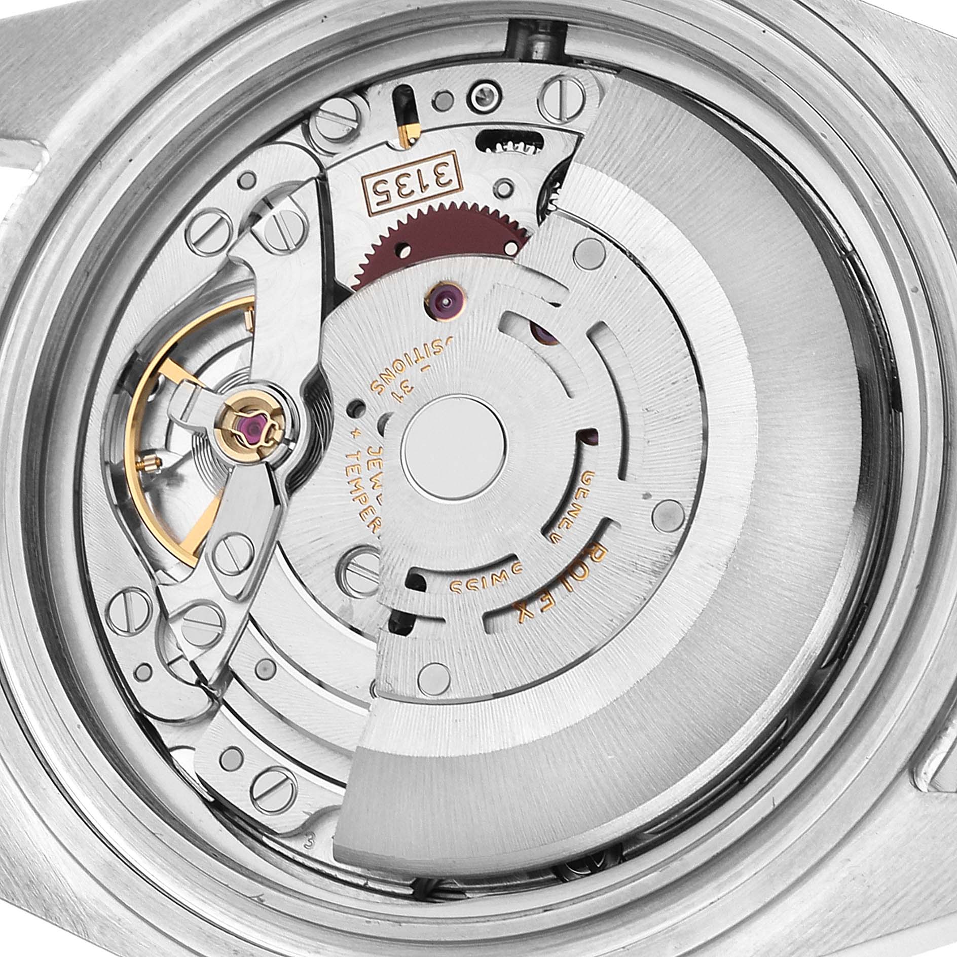 The image shows a close-up view of the movement mechanism inside a Rolex Submariner 16610 Men
s Stainless Steel Black Dial 16610 Men
s Stainless Steel Black Dial watch.
