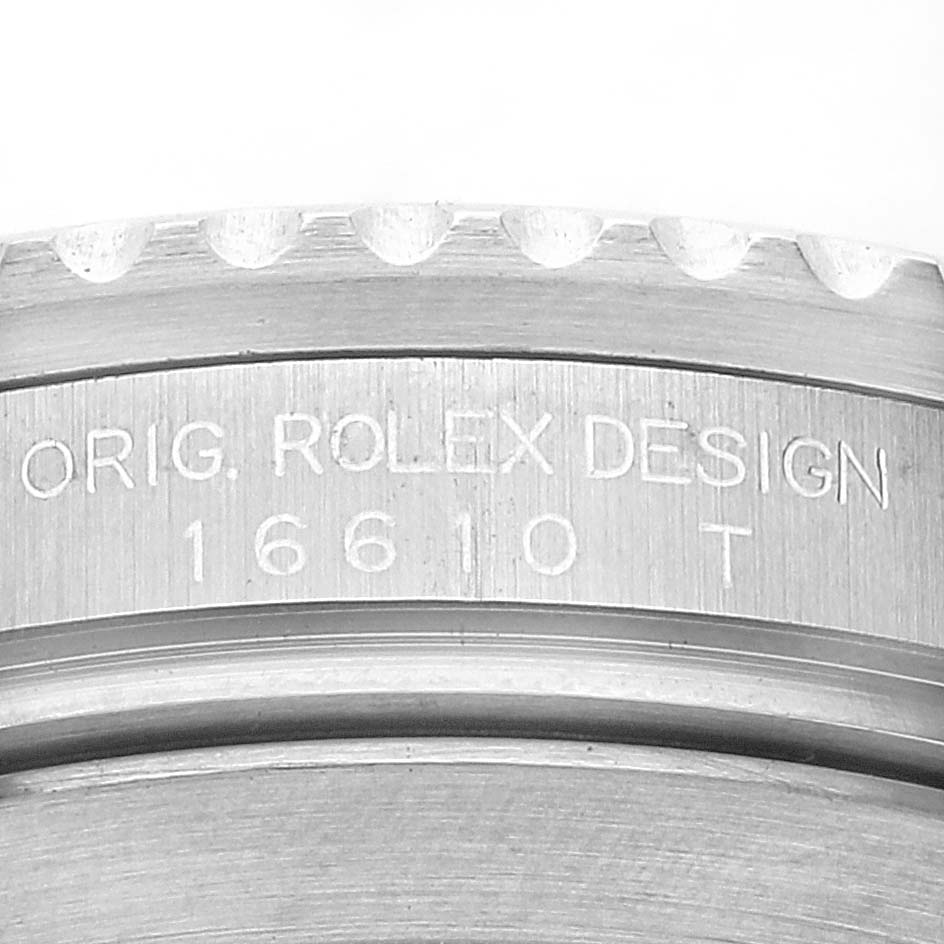 This image shows a close-up of the engraved case back of a Rolex Submariner 16610 Men
s Stainless Steel Black Dial 16610 Men
s Stainless Steel Black Dial model.
