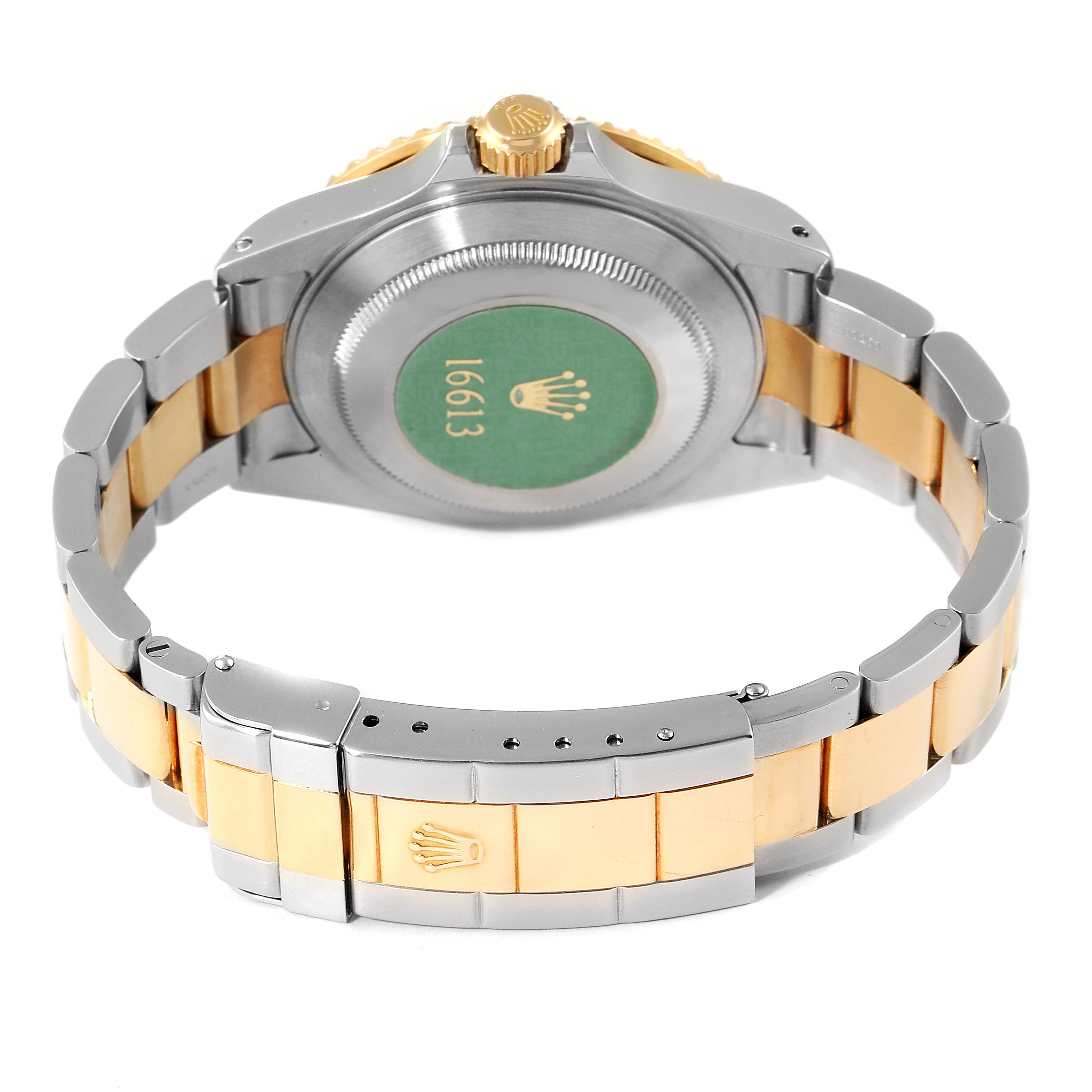 The image shows the backside and bracelet of a Rolex Submariner 16613 Men's Steel and Gold (two tone) Black Dial 16613 Men's Steel and Gold (two tone) Black Dial watch, highlighting the clasp, case back, and crown.