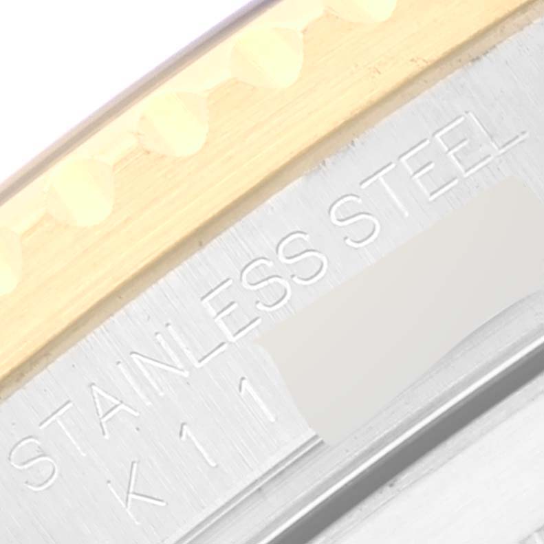 This image shows a close-up of the stainless steel engraving on the bezel of the Rolex Submariner 16613 Men's Steel and Gold (two tone) Blue Dial 16613 Men's Steel and Gold (two tone) Blue Dial watch.