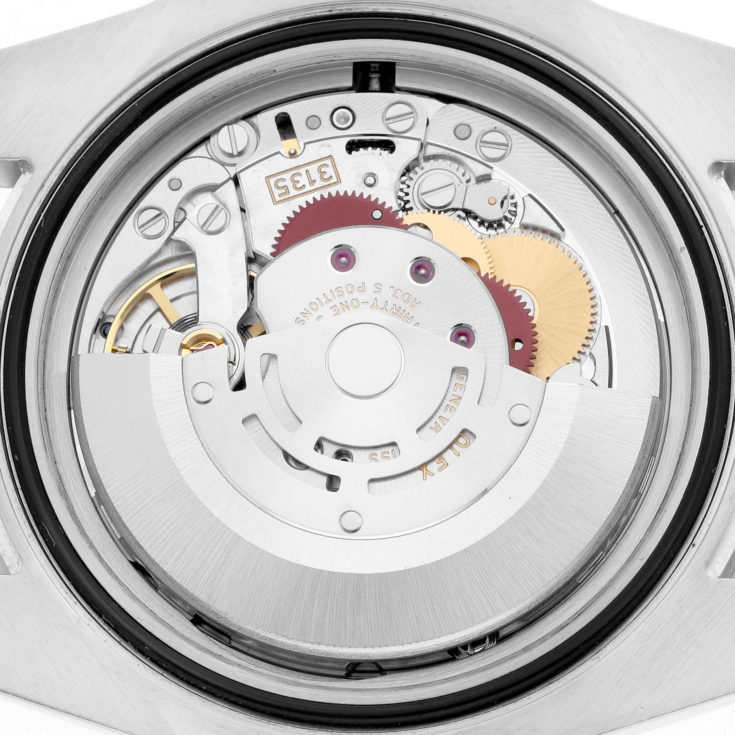 The image shows the movement of a Rolex Submariner 116610 Men's Stainless Steel Black Dial watch from the back, highlighting gears and rotors.