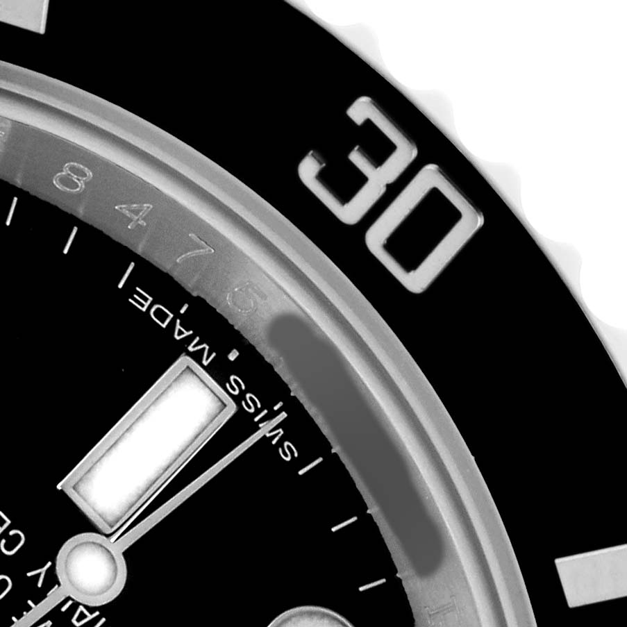 The image shows a close-up of the Rolex Submariner 116610 Men's Stainless Steel Black Dial dial and bezel, focusing on the minute indices and numeral "30."